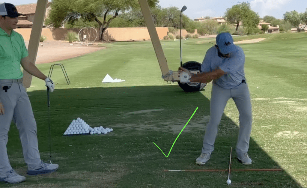 Milo Lines and Henry Fall demonstrating proper ball position for perfect weight shift in golf swing.